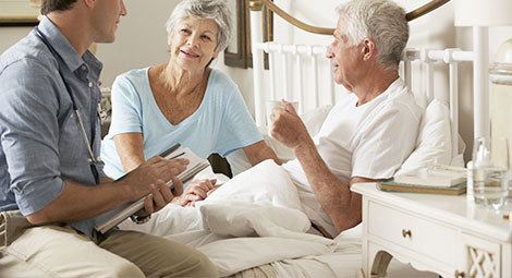 Doctor visiting patient at home